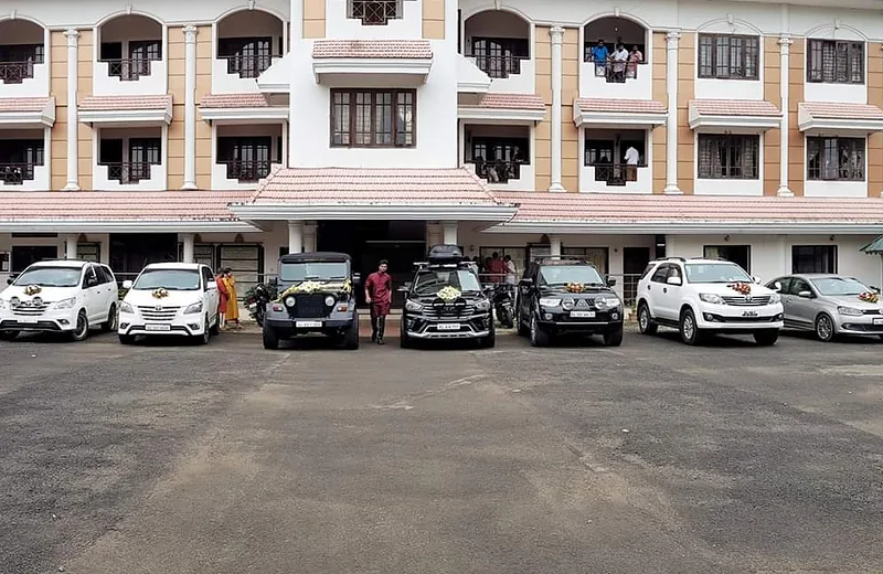 Apple Car Rentals fleet of sedans and SUVs parked and ready for rental in Trivandrum