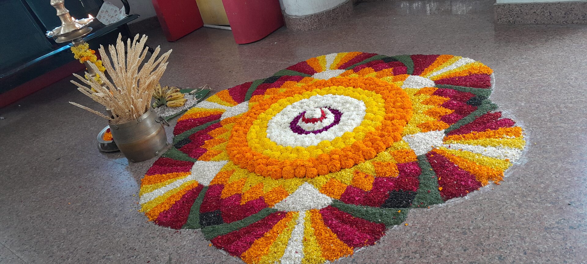 Onam special car rental offer in Kerala – festive Onam Pookalam flower carpet | Apple Car Rentals